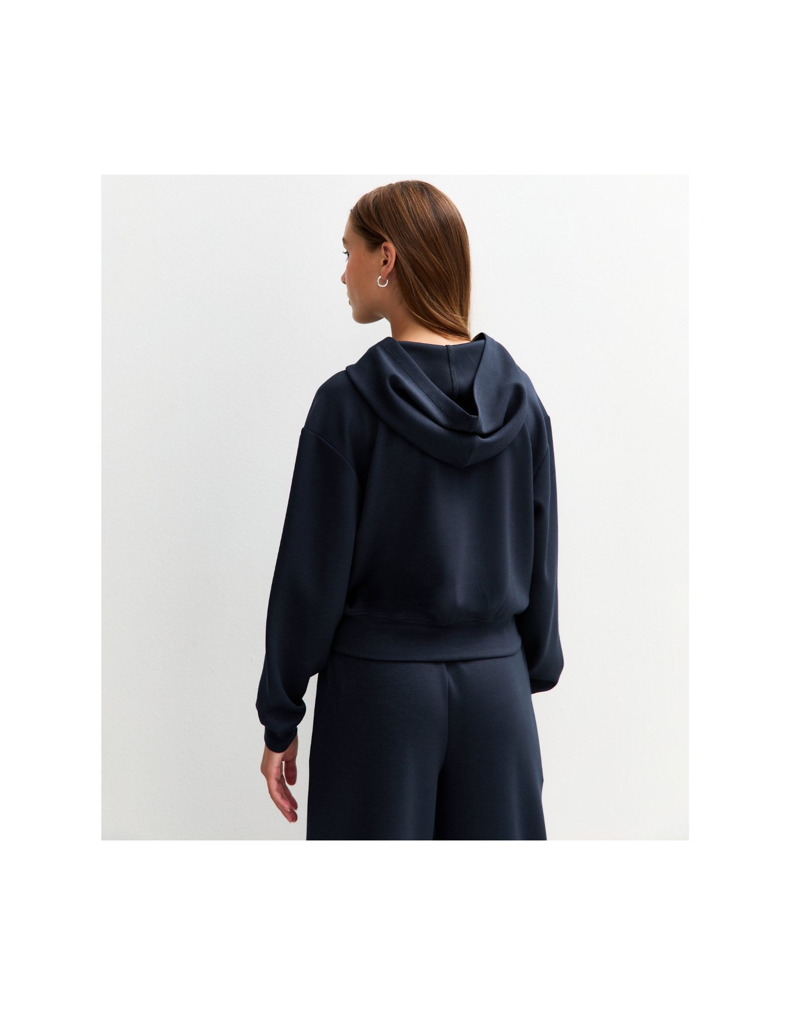 Back view of women’s zip-up hoodie